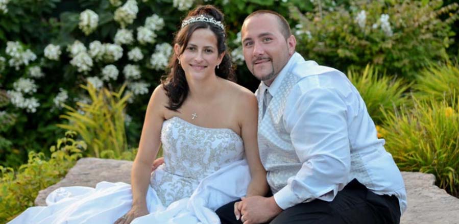 bride and groom sitting on golf course