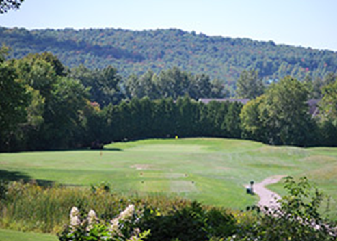 view of golf course with mountain